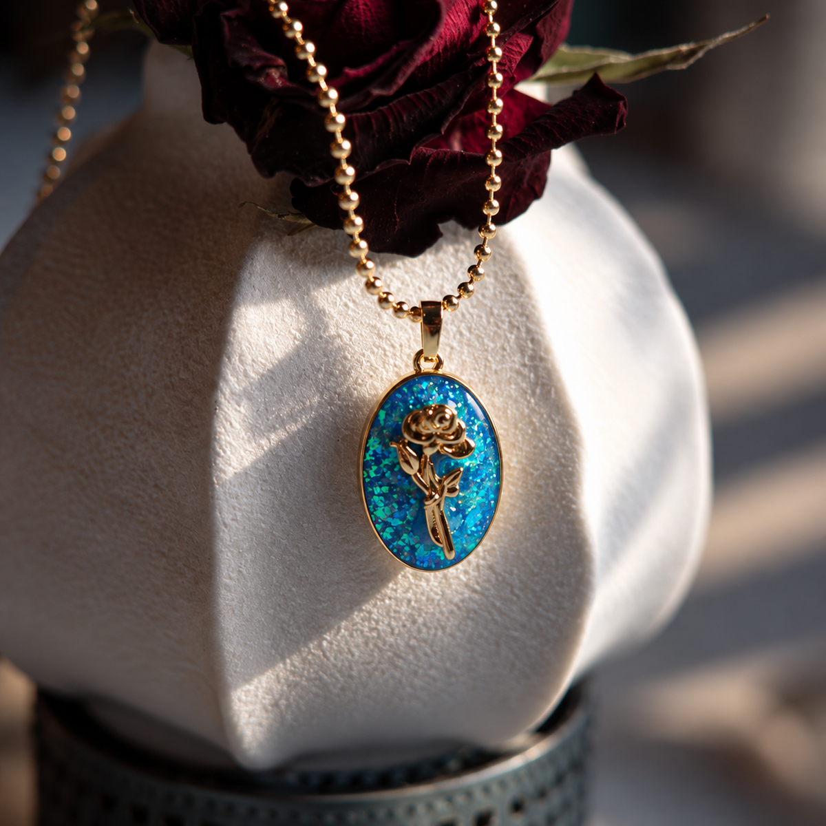 Blue opal look pendant necklace on display