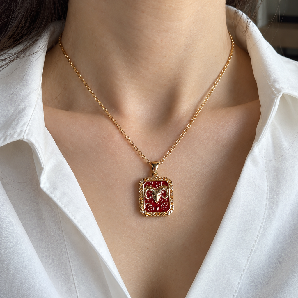 Aries zodiac necklace worn with white shirt