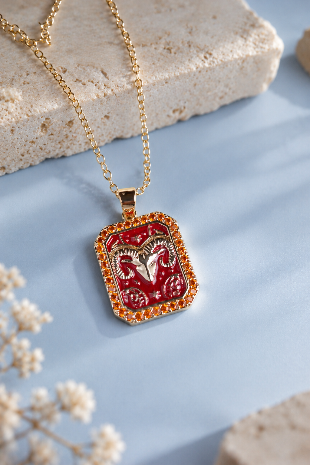 Aries zodiac necklace on cool blue backdrop